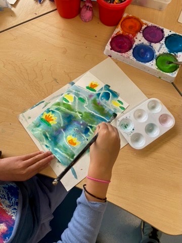 Students in a school art class supported by Children's Creative Project